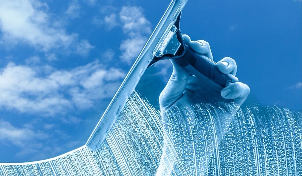 Glass facade cleaning services at Al-Caravan Restaurant – New Egypt commercial building